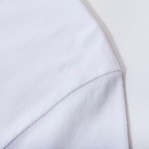 a close up of a white shirt on a white surface