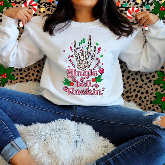 Sudadera con capucha con diseño de mano de esqueleto rosa y la frase "Jingle Bell Rockin"